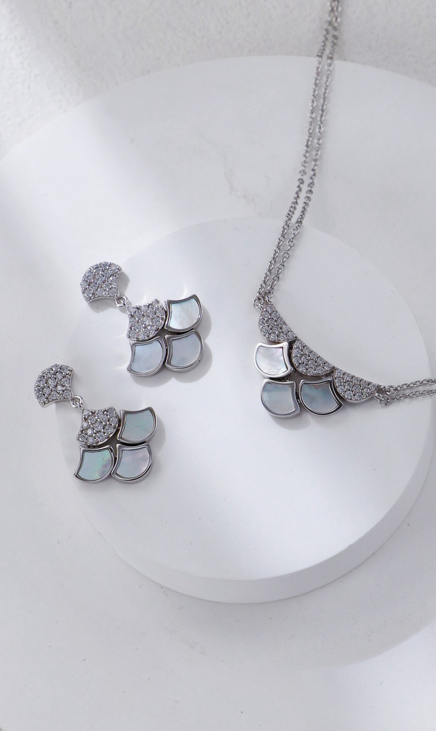 Jewelry set with necklace and earrings on a white background