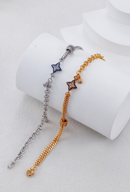 Two star-shaped bracelet options on a white cylindrical stand.