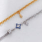 Two gold and silver bracelets with star-shaped charms on a white background
