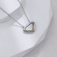 Triangular pendant necklace on a white background
