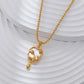 Gold necklace with a cat-shaped pendant on a white background