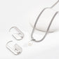 Silver necklace with a pearl pendant on a white background