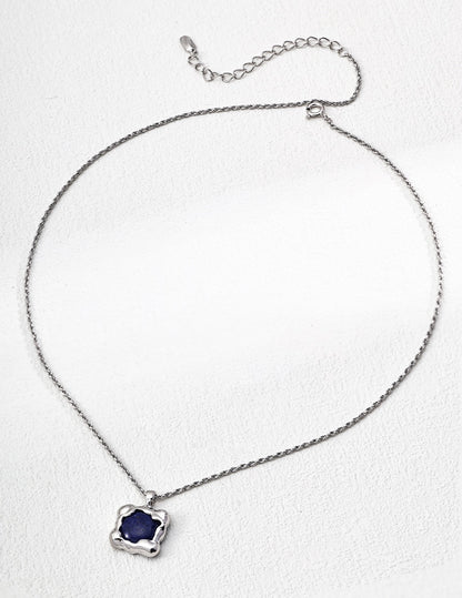 Necklace with a blue pendant on a white background