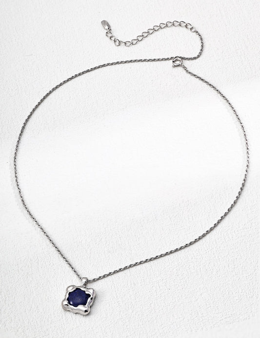 Necklace with a blue pendant on a white background