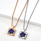 Two necklaces with blue pendants on rose gold and silver chains against a white background.