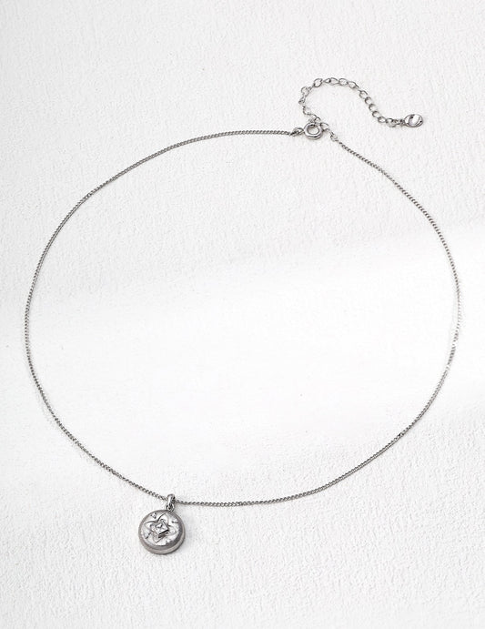 Silver necklace with a pendant on a white background