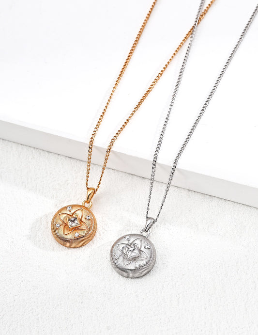 Two necklaces with circular pendants on a white background